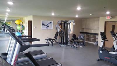 Fitness center with stair stepper and treadmill
